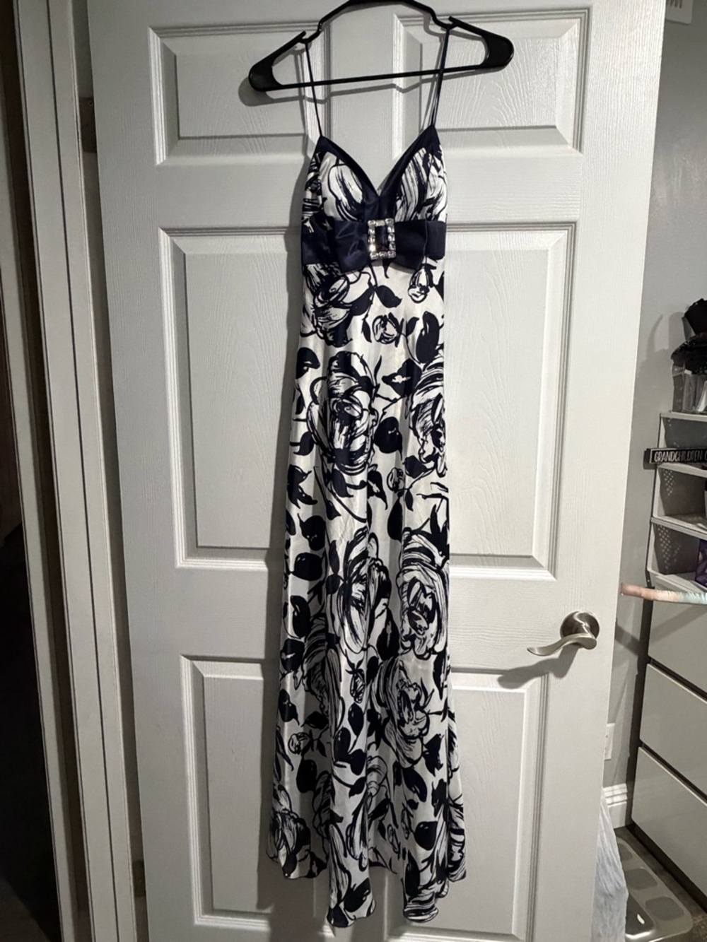 Navy and White Floral Maxi Dress with Rhinestone Bow Accent